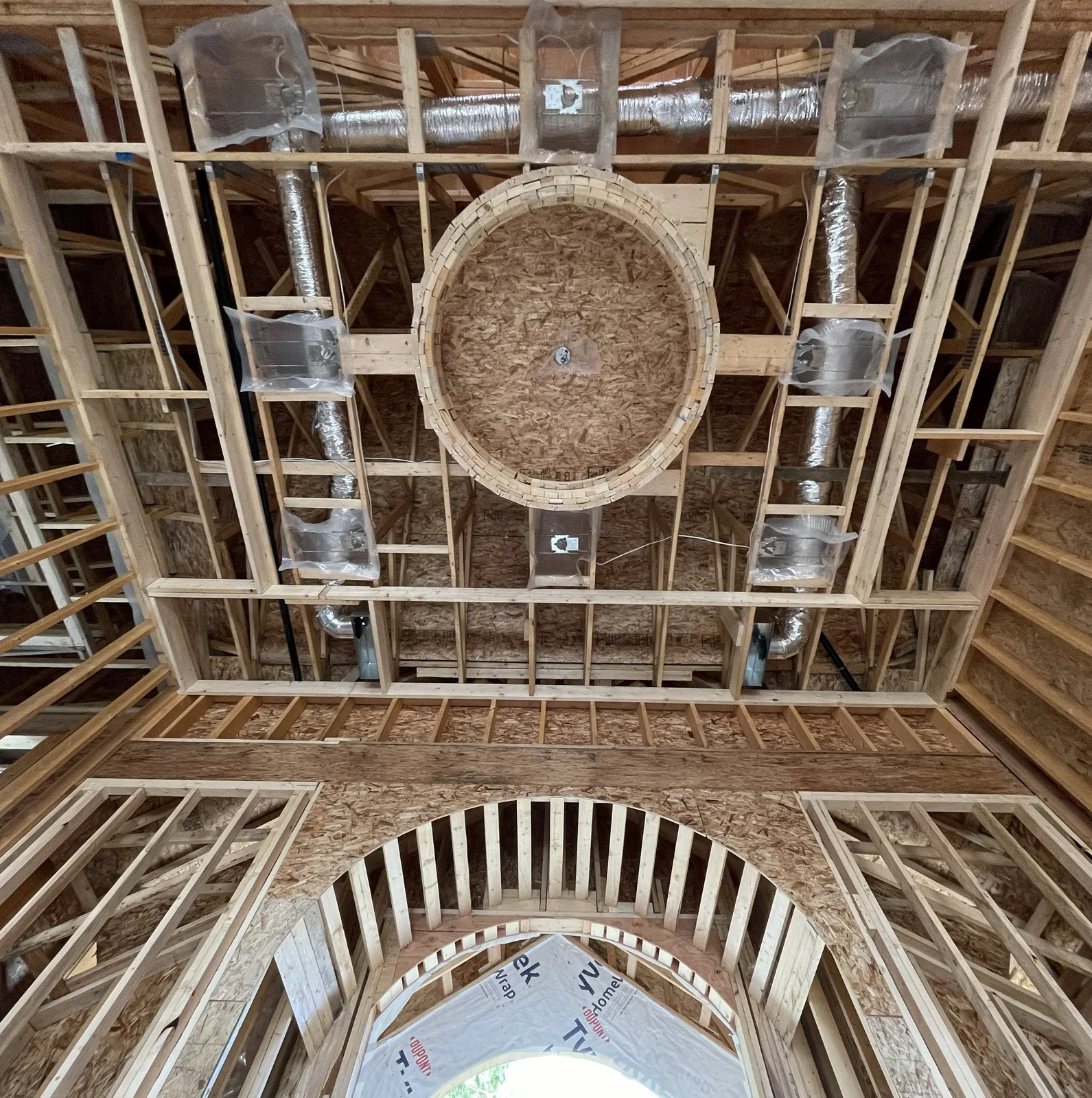 Detailed curved ceiling framing in a residential structure